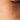 Close-up of a person's face with water droplets on skin