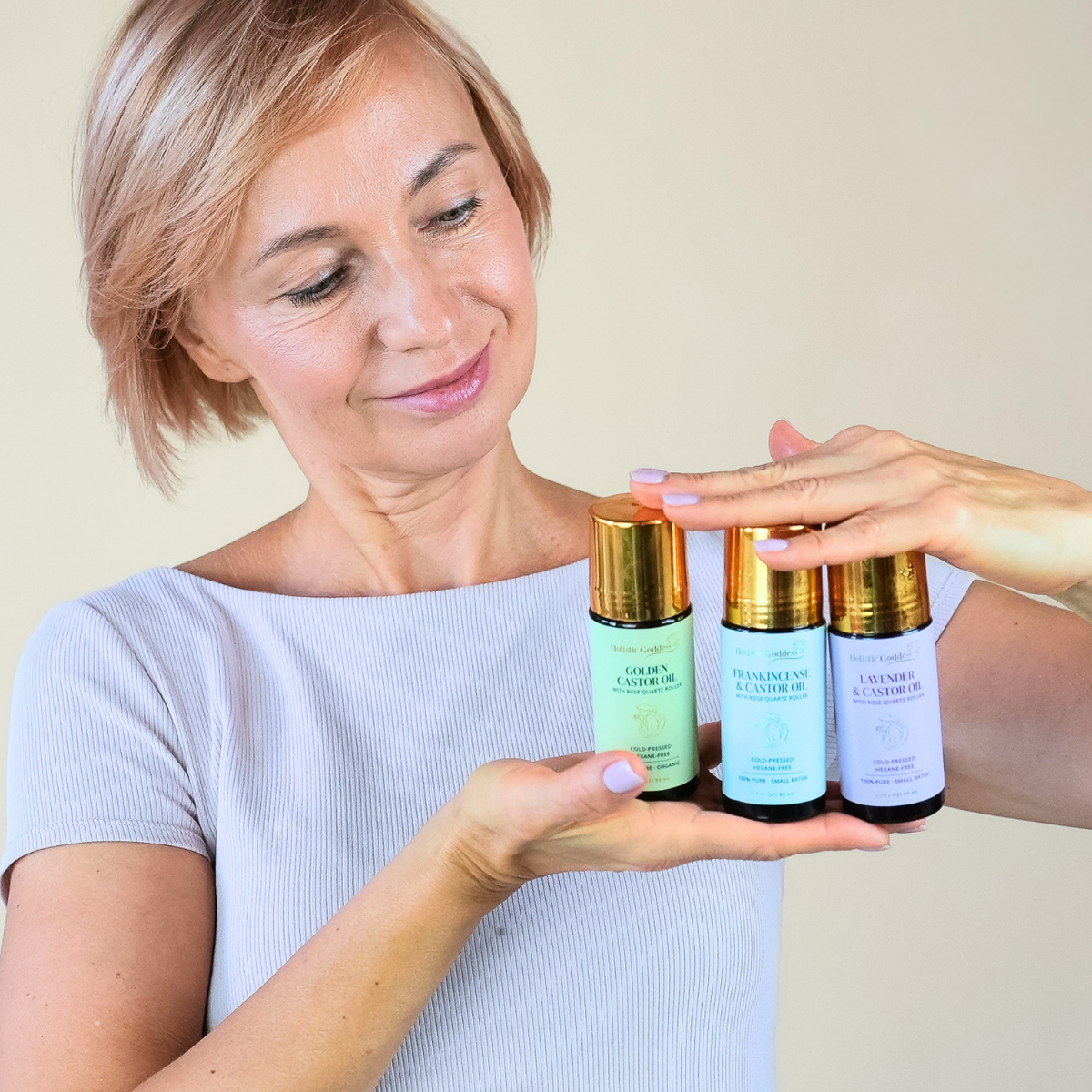 Holistic Goddess Castor Oil Trifecta with three organic castor oil roll-ons