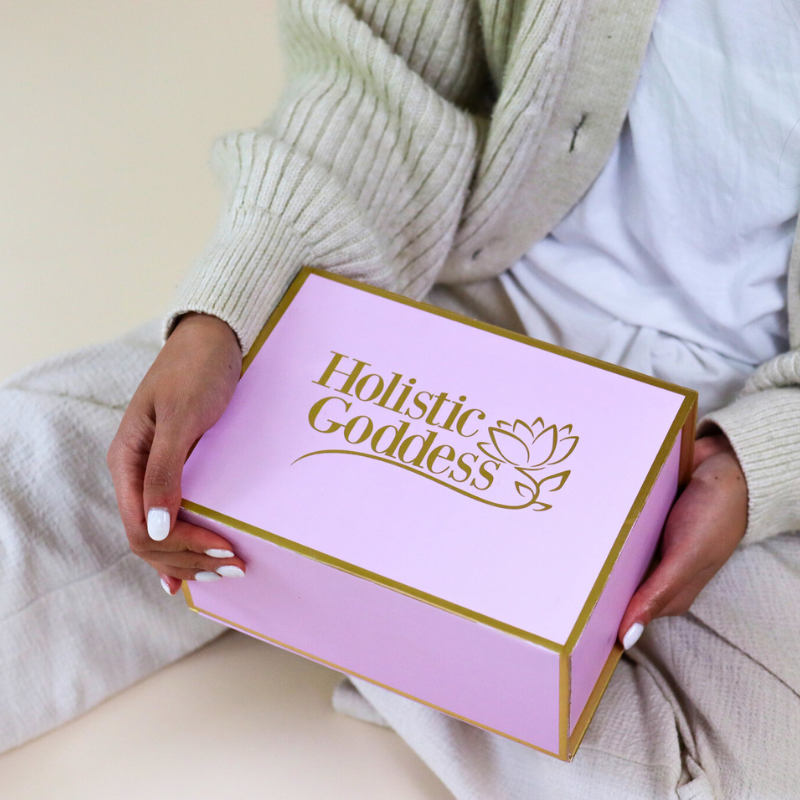 Magnetic Gift Box by Holistic Goddess – woman holding branded pink gift box on lap