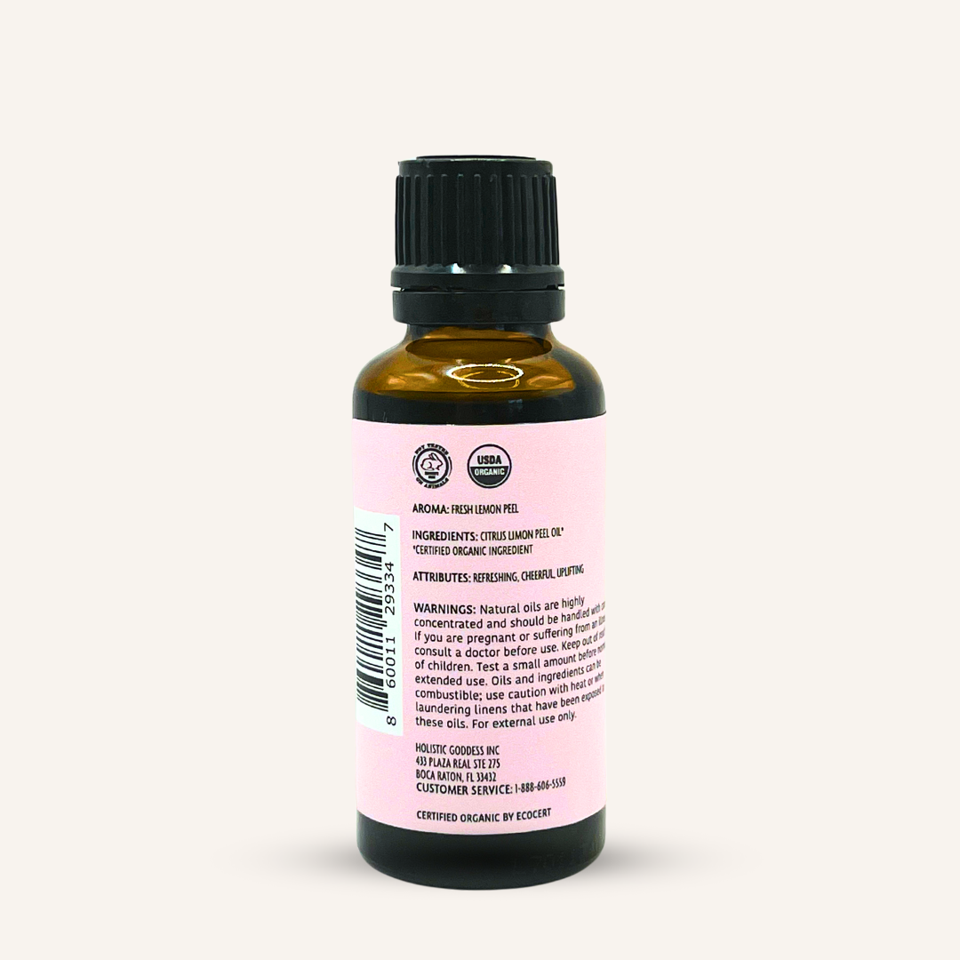 Organic Lemon Essential Oil by Holistic Goddess – bottle back label close-up with ingredients, aroma and warnings text