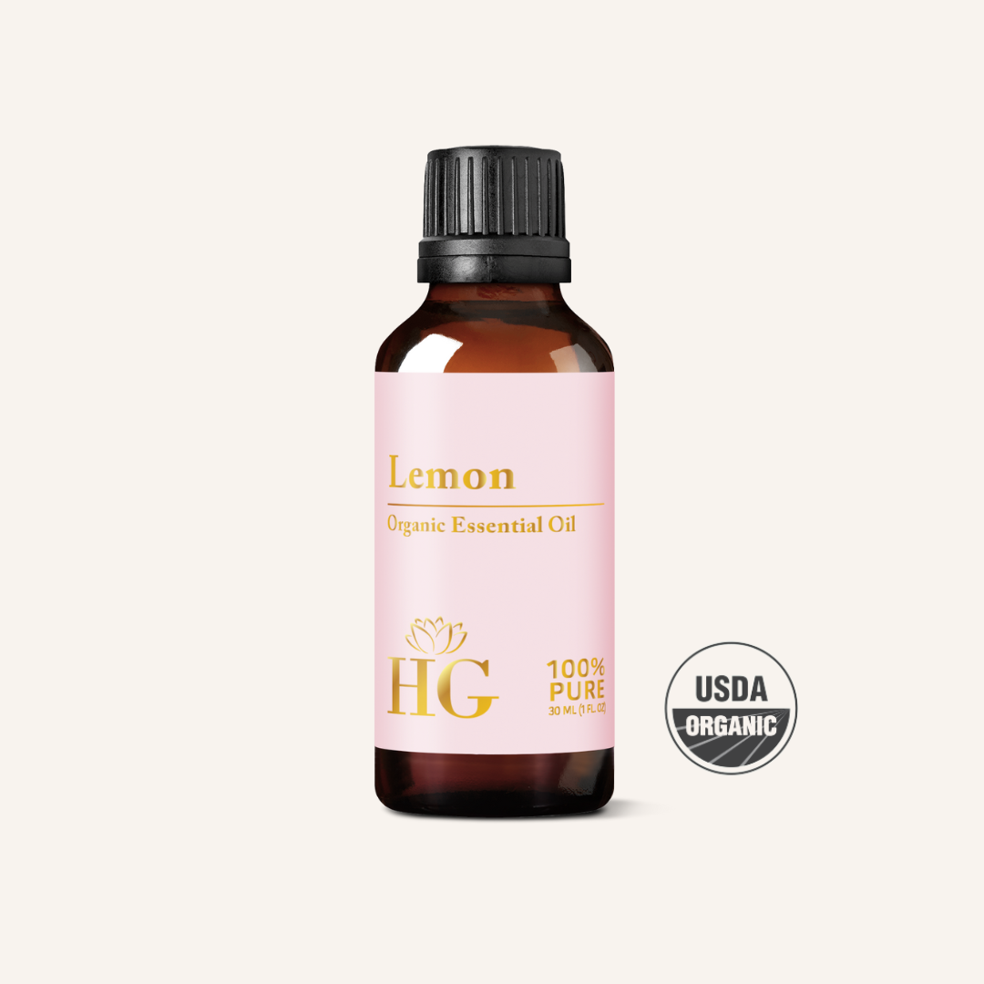 Organic Lemon Essential Oil by Holistic Goddess – bottle product shot, pink Lemon label 2