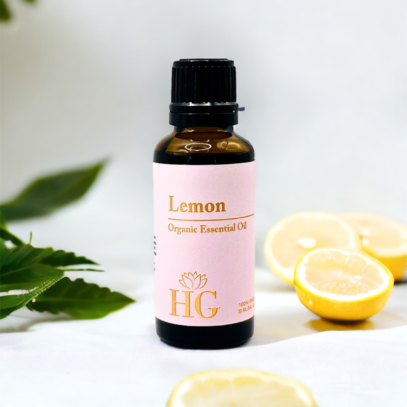 Organic Lemon Essential Oil by Holistic Goddess – bottle product shot, pink Lemon label