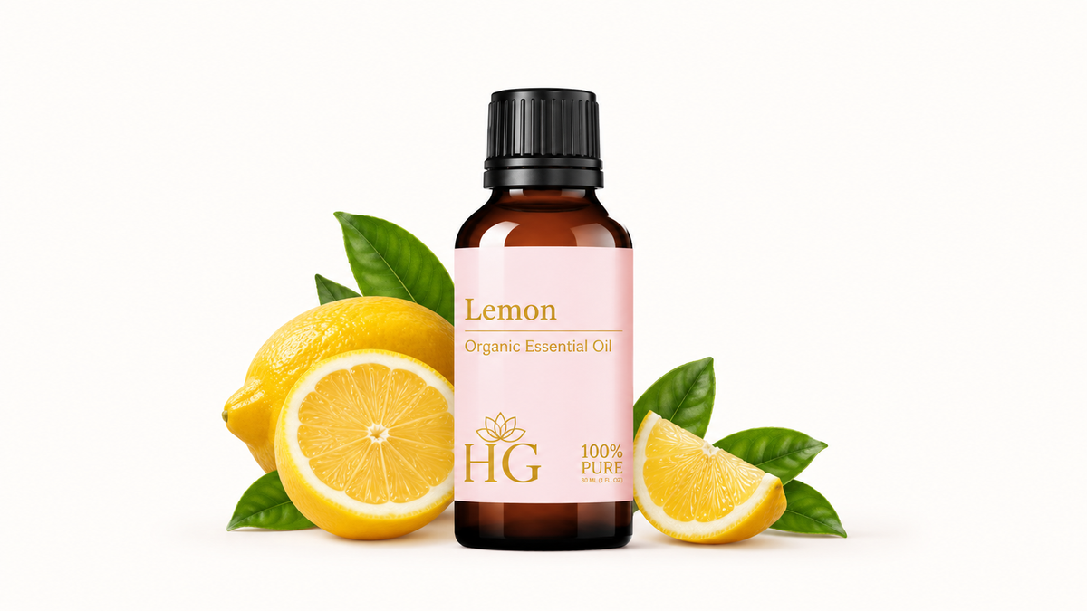 Organic Lemon Essential Oil by Holistic Goddess – bottle with lemon slices and leaves, empower your senses hero