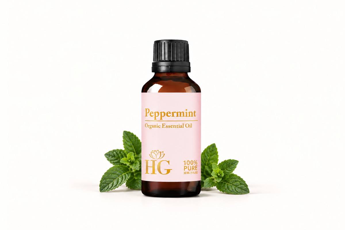Organic Peppermint Essential Oil by Holistic Goddess – bottle with mint leaves, empower your senses hero