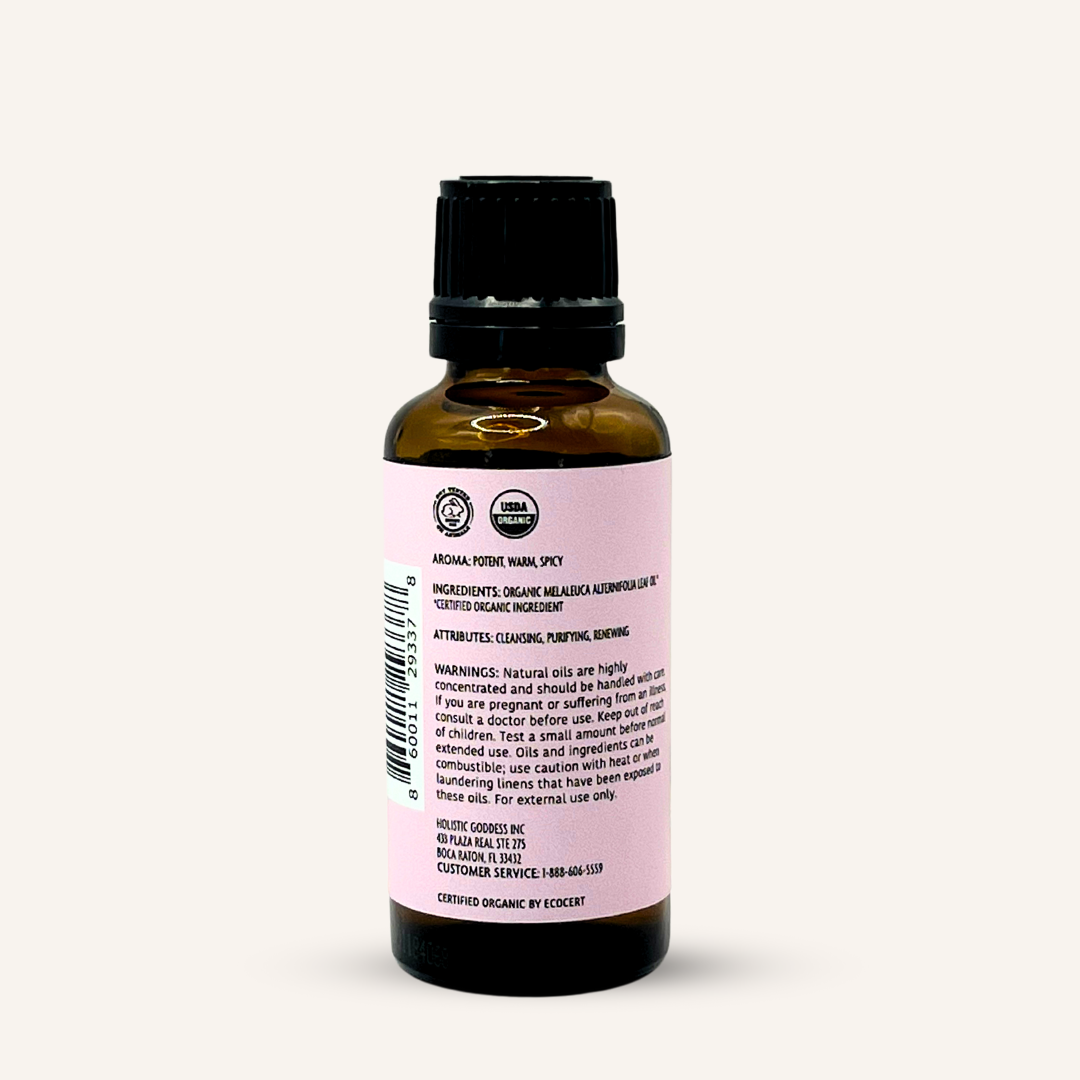Organic Tea Tree Essential Oil by Holistic Goddess – bottle back label close-up with ingredients, aroma and warnings text