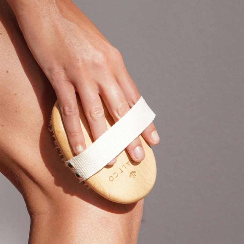 Dry Brush by LA SALT CO – woman brushing leg, exfoliating close-up
